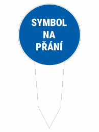 Blue circular sign reading 'SYMBOL NA PŘÁNÍ' mounted on a white stake, indicating a symbol is available on request