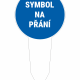 Blue circular sign reading 'SYMBOL NA PŘÁNÍ' mounted on a white stake, indicating a symbol is available on request