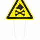Yellow triangular warning sign on a stake, showing a skull and crossbones and a dog head, indicating poison/toxic substance.
