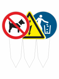 No dogs allowed sign paired with a caution triangle and a blue trash disposal icon in a row of signs on sticks.